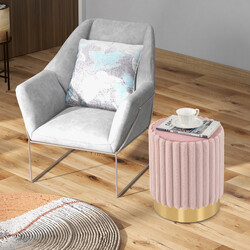 Rund rosa sammetspuff med stabil metallbas och mjuk stoppning