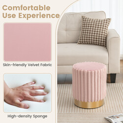Rund rosa sammetspuff med stabil metallbas och mjuk stoppning